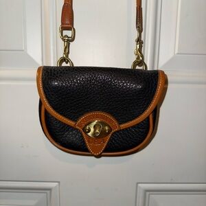 Dooney & Bourke Black and Brown Mini cross body bag.